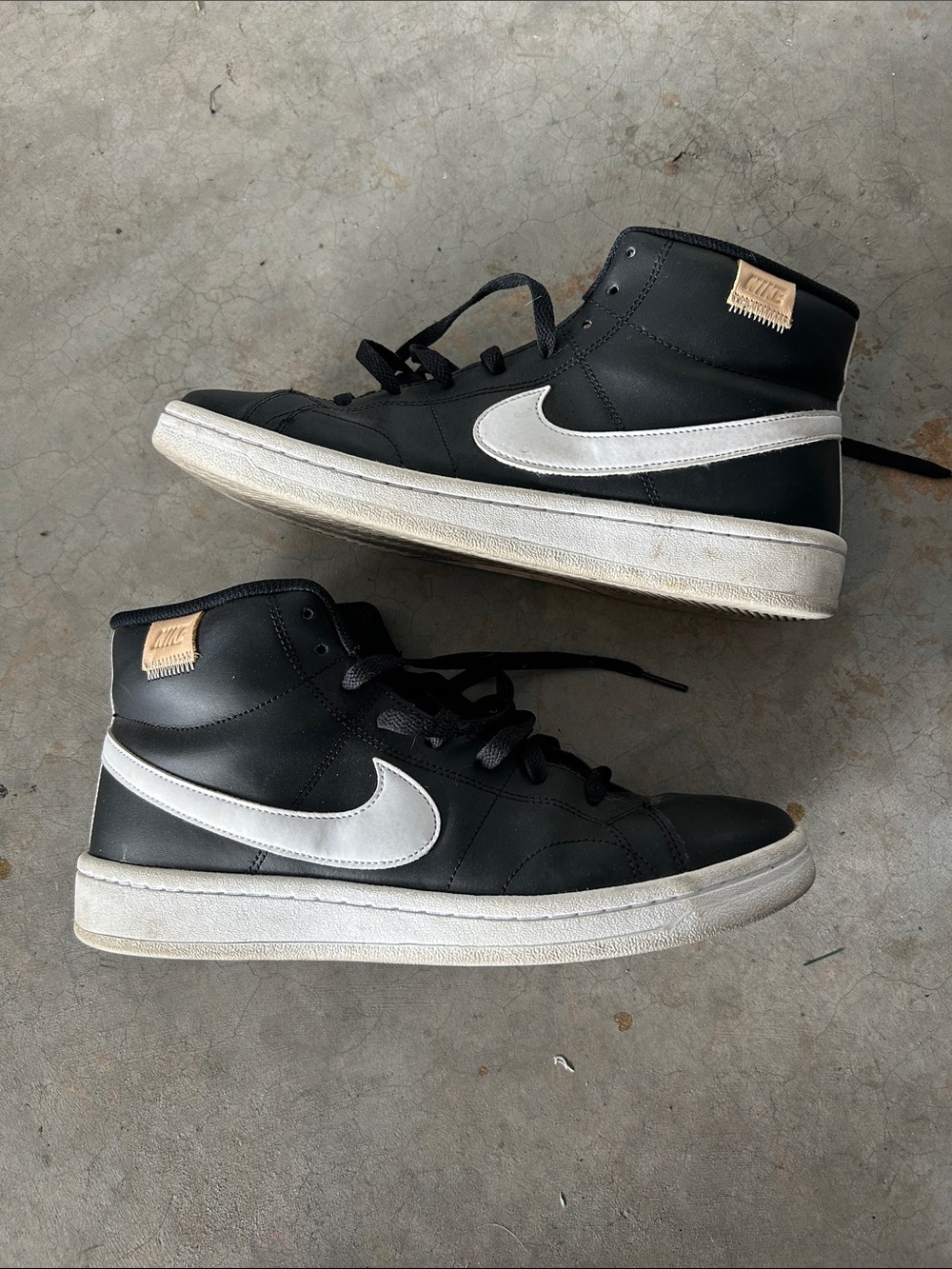 Nike Black High-Top Sneakers with White Swoosh and Tan Heel Patch